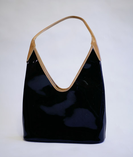 Black Vinyl V-Shaped Purse w/Tan Trim $4